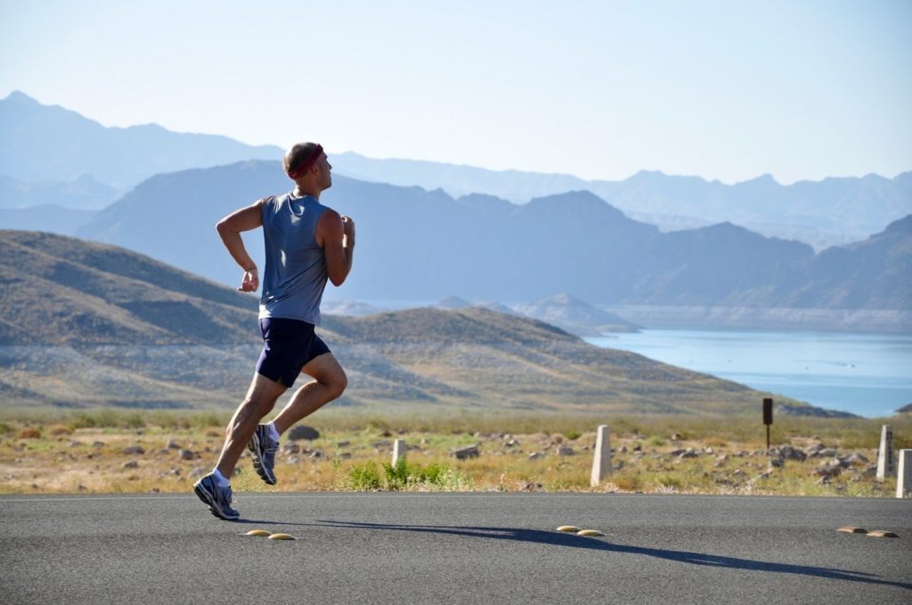 man running on mountain path